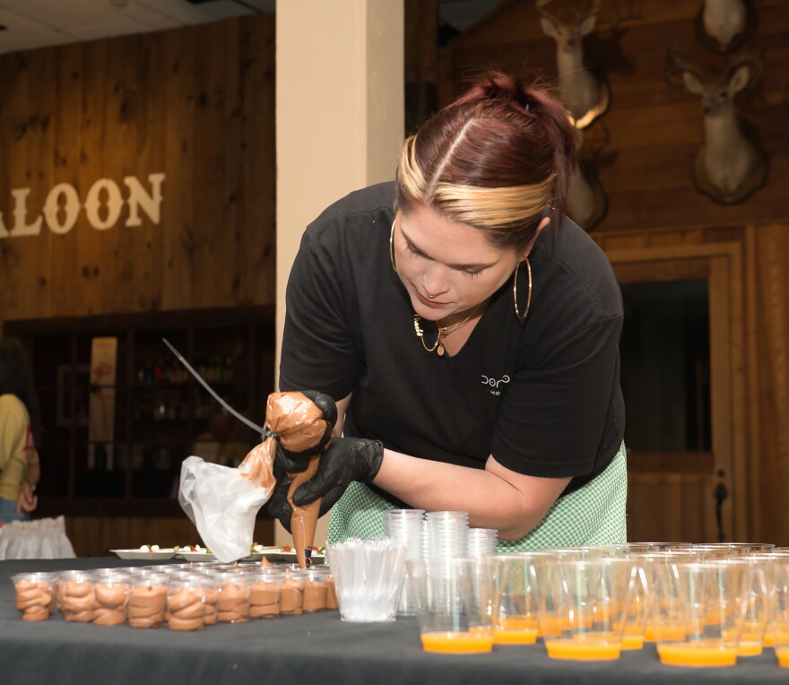 Phoebe Trotter prepares a food table during the 2025 KEDT Classic Brew. Trotter will compete in the pro chef category at the Texas Food Championship, Sept. 25-27, in Corpus Christi.