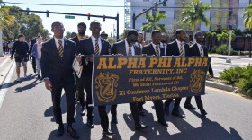 Members of the Alpha Phi Alpha fraternity lead the Martin Luther King Jr. Day commemorative march in downtown Fort Myers.