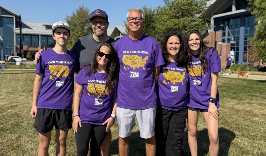 Picture of several people in purple Alzheimer's Association shirts at Heartland Community College event