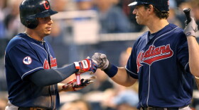 Asdrubal Cabrera (left) leads the resurgent Cleveland Indians in hitting. Here, he's congratulated by Travis Buck after crossing home plate.