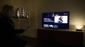 This photo shows a television screen displaying the French user interface of US online streaming giant Netflix (Stephanie De Sakutin/Getty Images)