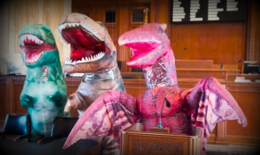 Richard Nelson's candidacy for governor video announcement featured actors costumed as dinosaurs representing out-of-touch career politicians.
