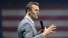 FILE - Turning Point USA Founder Charlie Kirk speaks before Republican presidential candidate former President Donald Trump arrives at the Turning Point Believers' Summit, July 26, 2024, in West Palm Beach, Fla.