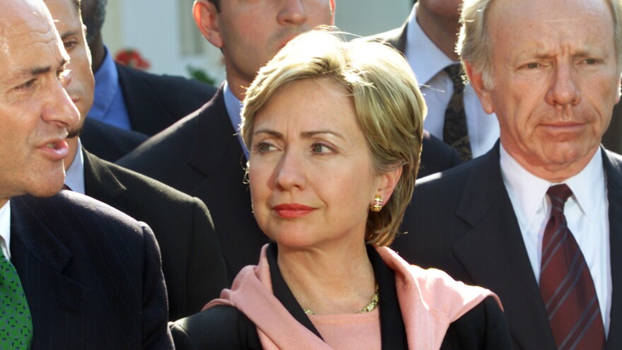 Then-Sen. Hillary Clinton stands with members of New York's congressional delegation and other lawmakers after a meeting with President Bush at the White House on Sept. 13, 2001.