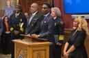From left: Wayne Drummond, Blaine Griffin, Mayor Justin Bibb, Dorothy Todd and Leigh Anderson stand during a Feb. 19, 2026, news conference to provide an update on Cleveland's consent decree.