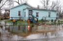 The street and yard of a home in then Centreville flood during a rainstorm in March. Residents of Centreville, which is now Cahokia Heights, say the sewage and flooding issues haven't been addressed after years of complaints.