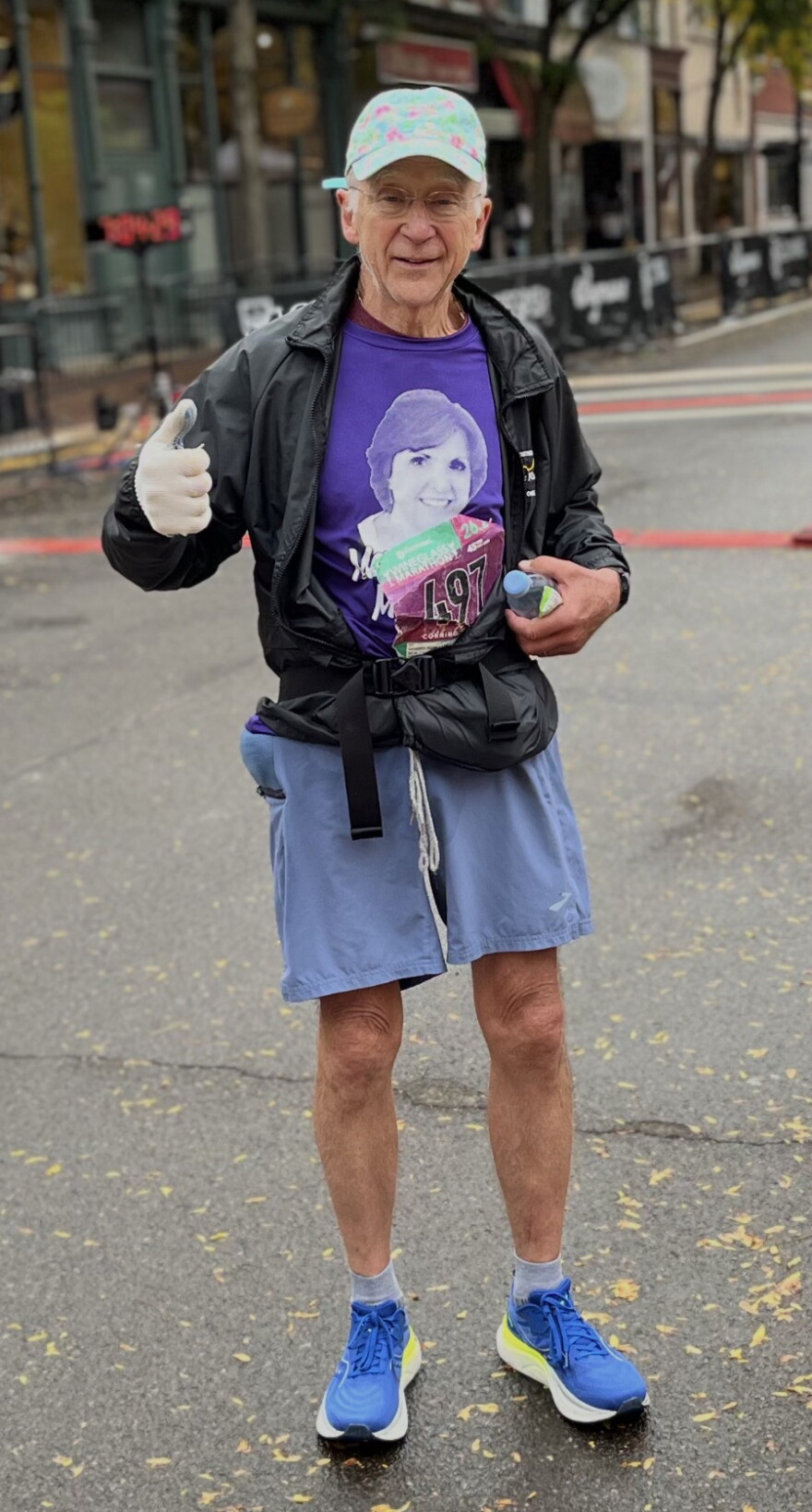 George runs a marathon honoring his late wife, Mary Ann, with her face on his shirt.