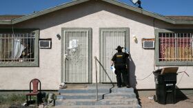 Maricopa County constable Darlene Martinez knocks on a door before posting an eviction order on Oct. 1, 2020, in Phoenix. An extended eviction moratorium ordered by the Centers for Disease Control and Prevention has been struck down.