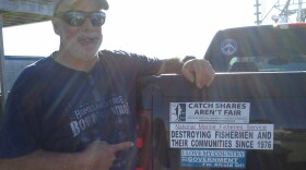 Rhode Island fisherman Joel Hovanesian points to the bumper sticker he says he created. 