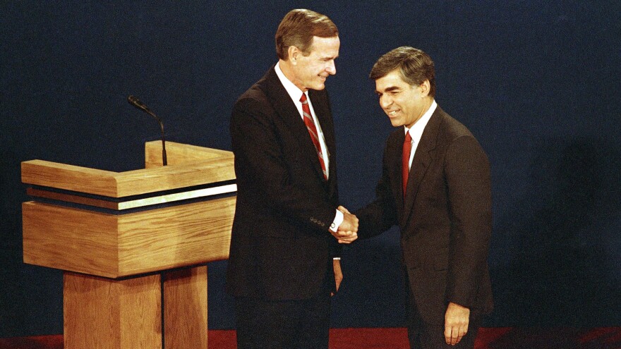 Then-Vice President George H.W. Bush (left) shakes hands with candidate Michael Dukakis at the start of the presidential debate in Winston-Salem, N.C., in 1988.