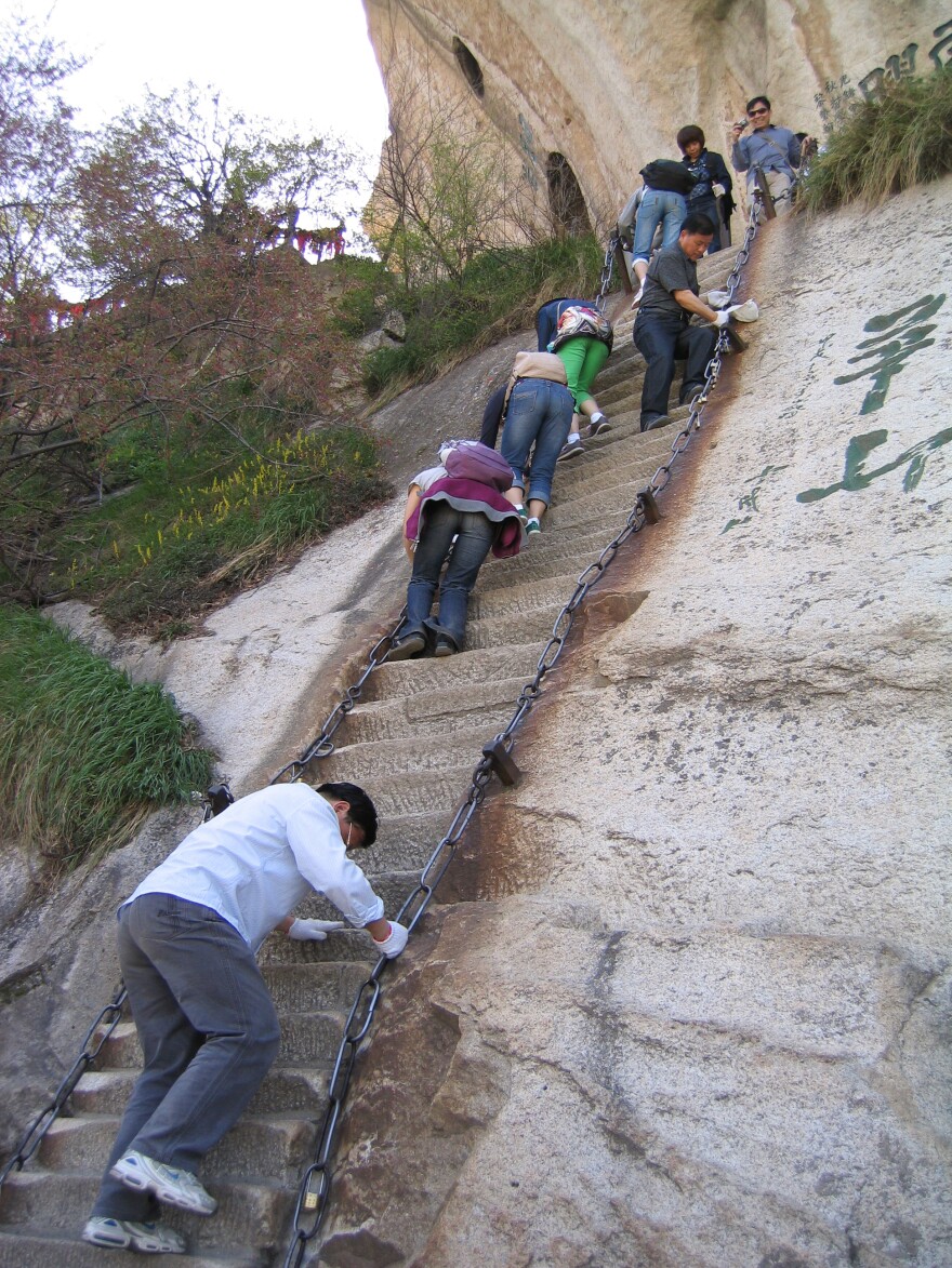 There are many footholds and steep staircases carved into the mountain itself.