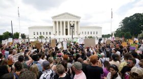 Protesters gather outside the Supreme Court in Washington, Friday, June 24, 2022. The Supreme Court has ended constitutional protections for abortion that had been in place nearly 50 years, a decision by its conservative majority to overturn the court's landmark abortion cases. (AP Photo/Steve Helber)