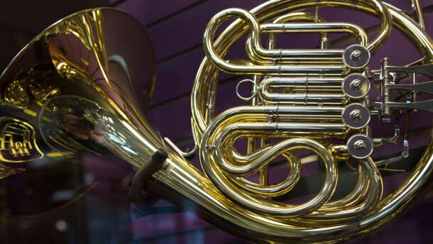 Golden french horn concept music instrument close up