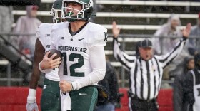 Michigan State quarterback Katin Houser (12) celebrates after scoring a touchdown during the first half of an NCAA college football game against Rutgers Saturday, Oct. 14, 2023, in Piscataway, NJ. (AP Photo/Bryan Woolston)