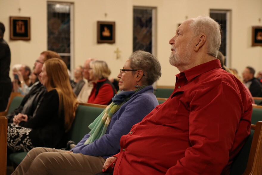 Kenneth Warner, 78, listens to mass alongside his wife, Flora Warner, 77, at St. Patrick Church in Gainesville, FL. (Nicole Beltran/WUFT News)