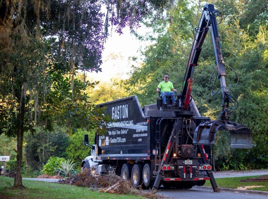 Steve Miner operates a debris removal truck on Northwest 15th Avenue in Gainesville, Fla., on Wednesday, October 30, 2024. (Hanna Maglio/WUFT)