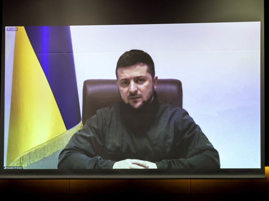 Ukrainian President Volodymyr Zelenskyy — seen here addressing Japanese lawmakers on March 23 — spoke via video link to NATO leaders and later, the G-7.