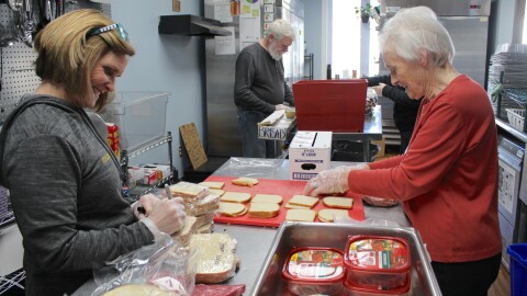 Volunteers in the Hunger and Health Coalition Food Recovery Kitchen help make sandwiches to be included in meals distributed to clients.