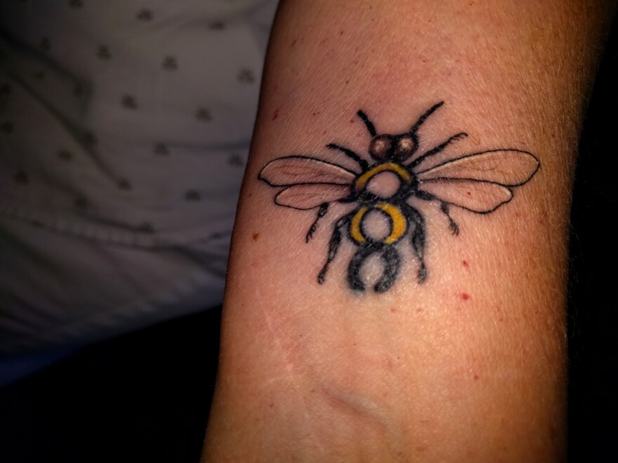 A bee tattoo