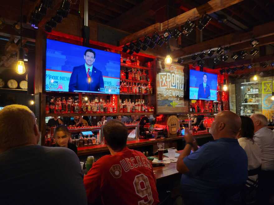 Potential voters watch the first Republican presidential debate of the 2024 campaign season at The Explorium Brewpub in Milwaukee, Wisconsin on Wednesday.