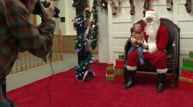 Santa Claus takes notes during Spencer Main Street's "Christmas at the Square" in Spencer on Saturday