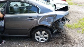 A rear-ended car with damage.