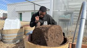Khalid Walker fills his barrel with soil made possible by the Outdoor Education and Recreation Grant Program for the plant systems class offered at Churchill County High School in Fallon, Nevada, on Feb. 12, 2025.