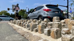Upturned cobblestones at the intersection of Route 6 and Pleasant Street in New Bedford.
