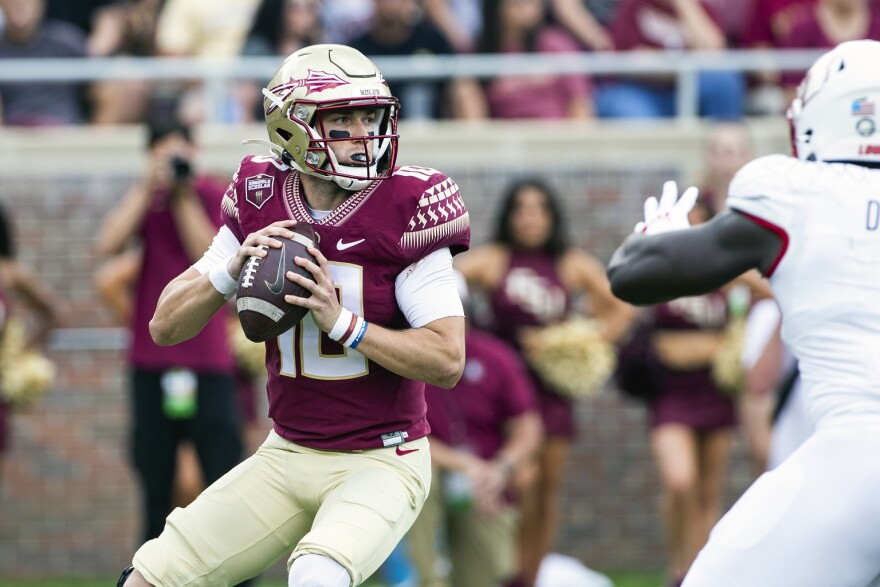 Florida State quarterback McKenzie Milton looks to pass in the first half of an NCAA college football game against Louisville in Tallahassee, Sept. 25, 2021.