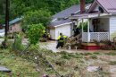 Rescuers travel door to door checking with residents during flooding in Dante that started July 18 and lasted through the weekend