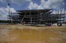 Workers at the planned Carolina Panthers site in 2021. Construction never got much past this point before the project was terminated.