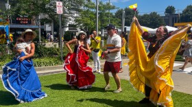 Elsa Bohorquez (right) dances to vallenato, a Colombian folk genre of music, with her two daughters Cielo Urrego (mid-left) and Gina Bohorquez (left), her son-in-law and her grandchild. The family came down from Bridgeport to celebrate Colombian Independence Day in Stamford. Bohorquez said, "Even though I have to work [in the morning], I’m here to enjoy.”