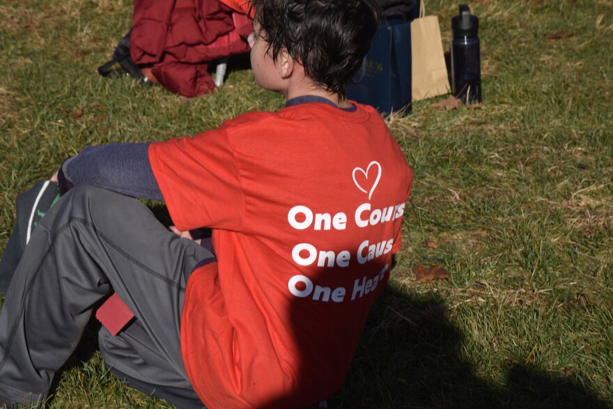 Some participants wore a red shirt that reads "One Course. One Cause. One Heart." 
