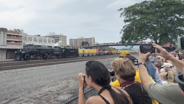 People waved as the Big Boy came through the rail tracks outside of the Railroaders Memorial Museum in Altoona on Wednesday, July 8. Many people stood on the  pedestrian bridges over the train tracks and nearby building rooftops. 