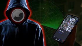A phone showing an air tag location with a suspect in a hoodie and green tracker in the background 