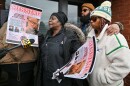 The adopted family of La'Niyah "Lala" Clark stand outside the Wilkes-Barre Police Department, including, from left: grandmother Carmen Tinson, father Antione Clark, and mother Ameerah Woods.