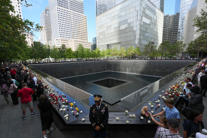 A U.S. Army warrant officer stands by a reflecting pool during a memorial on the 25th anniversary of the September 11, 2001, terrorist attacks, Friday, Sept. 11, 2026, in New York. (AP Photo/Adam Gray, Pool)