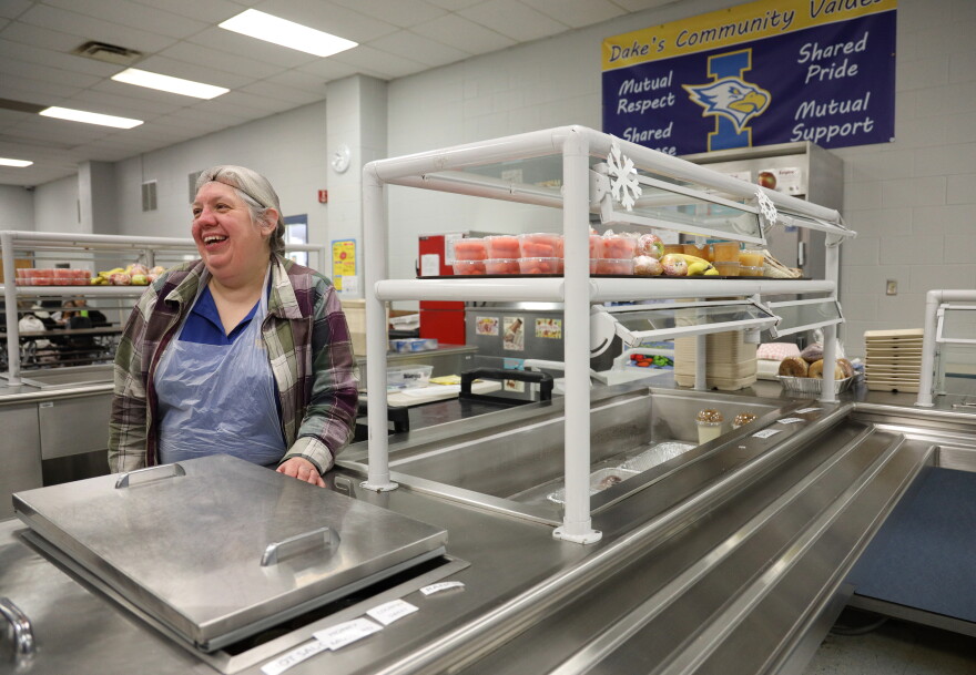Debbie Lane, a food service employee at West Irondequoit CSD, prepares for students to receive lunches at Dake Jr. High School.