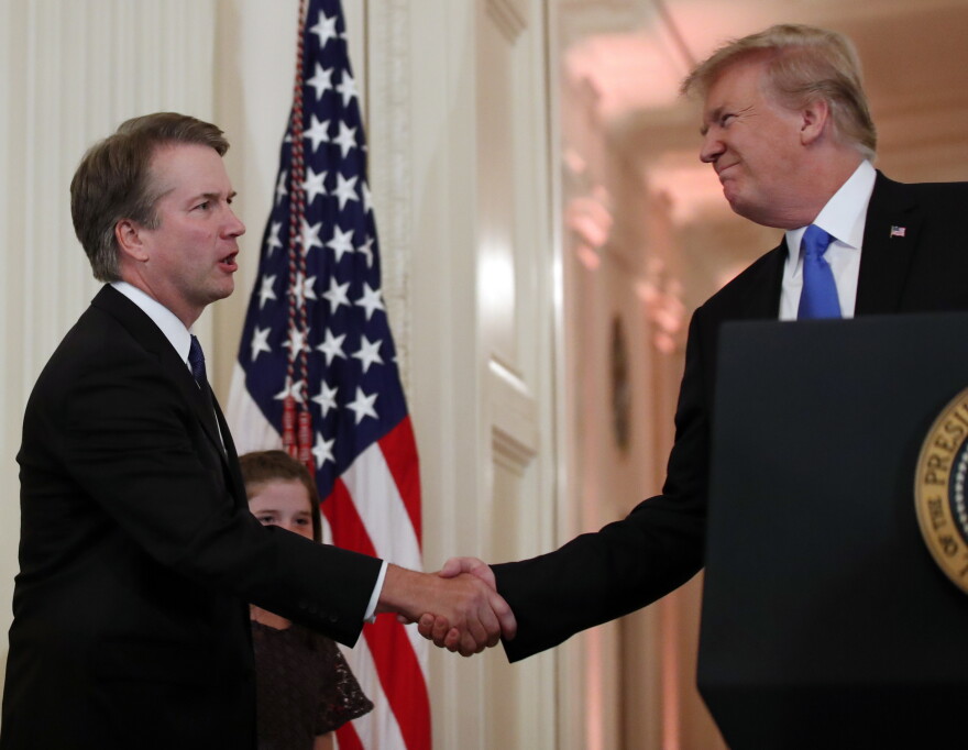 President Donald Trump shakes hands with Judge Brett Kavanaugh, his Supreme Court nominee, in the East Room of the White House on Monday, July 9. 