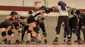 Roller derby teams ready themselves before the whistle blows at the Broadway Recreation Center in Mesa, Arizona. (Jill Ryan/KJZZ)
