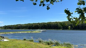  Blue lake is shown on a sunny day.