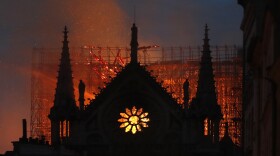 Flames and smoke rise from Notre Dame cathedral as it burns in Paris, Monday, April 15, 2019.