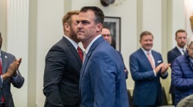 Oklahoma Gov. Kevin Stitt shakes hands after delivering his State of the State address on Feb. 6, 2023.