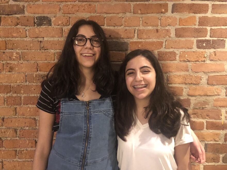 a picture of Zena and Mena Nasiri against a brick wall