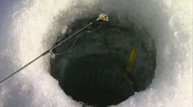 Ice fishing hole (file)