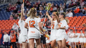 Syracuse players (white) gather after scoring a fourth quarter goal against No. 6 Stanford.