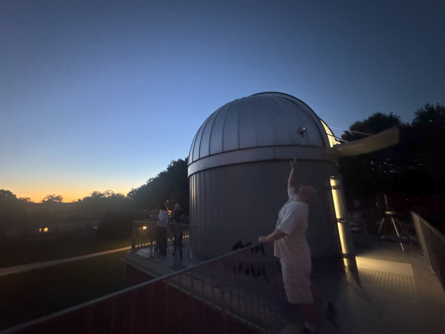 As the sky darkens, visitors gather outside the Keeble Observatory at Randolph-Macon College in Ashland.