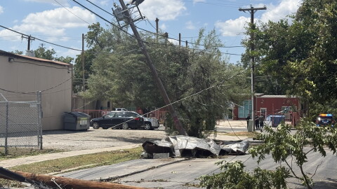Storm damage at Flores and Cypress streets in San Antonio, where high winds brought down utility poles, power lines and tree limbs following Friday night’s severe storms.