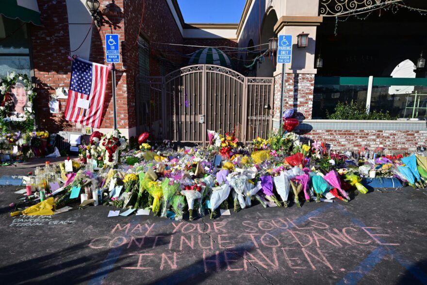 A makeshift memorial for victims of a mass shooting is pictured in front of the Star Ballroom Dance Studio in Monterey Park, California.