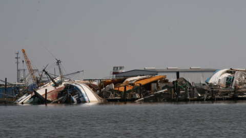 Damaged shrimp boats on channel leading to Venetian Isle, New Orleans Sep 9, 2005.